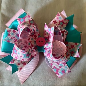 Homemade pink and turquoise hair bow